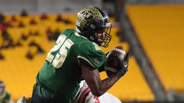 Penn State football commit Quinton Martin runs with the football for Belle Vernon.